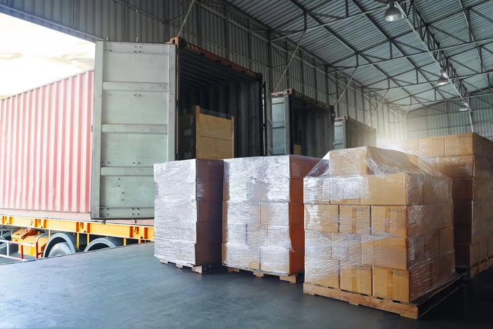 Mountaiin Sea private-label haircare products wrapped in plastic film are loaded into shipping containers and transported to the distribution centre for dispatch.